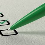 green pen creating a checklist