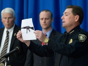 University of Central Florida Police Chief Richard Beary (right) holds a photo of the type of weapon a student planned to use in a campus attack. UCF President John C. Hitt (left) and UCF Spokesperson Grant Heston (center ) look on. 