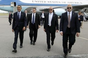 QUESTIONABLE SERVICE: The Secret Service, seen here with President Obama, is under scrutiny following a series of embarrassing scandals. On September 19th a man scaled a fence, then ran past guards into the White House, where he was eventually apprehended. The incident led to the resignation of Secret Service director Julia Pierson.