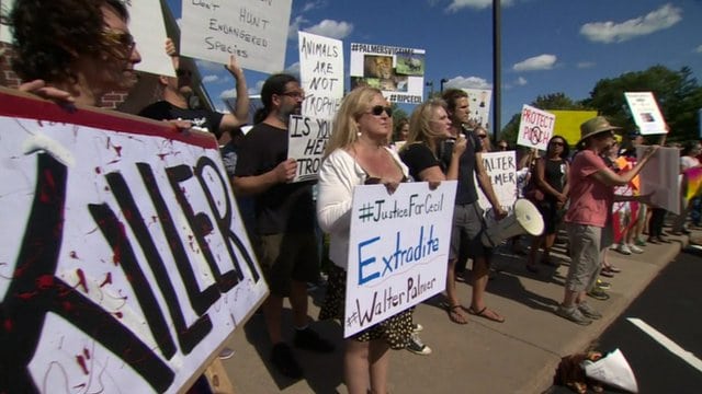 Protesters gather outside Walter Palmer's dental practice. 