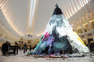 Dressed Down: A mannequin atop 28 feet of old clothes urges commuters at NY’s Oculus to recycle garments. The Electric Coffin-built installation was part of Unilever’s and Savers’ out-of-home, cause-marketing display, Feb. 6-7. Source: Unilever/Getty Images