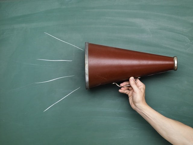 megaphone against a chalkboard