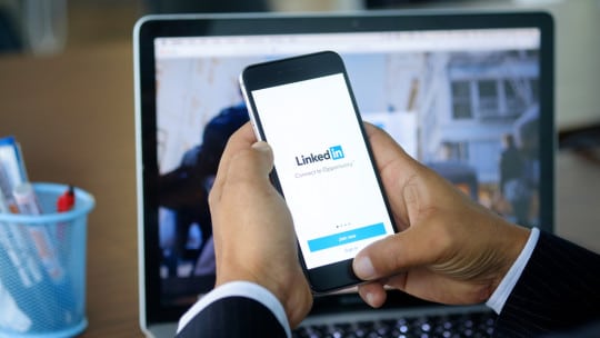 LinkedIn Creator Mode on a mobile phone and laptop