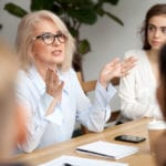 women around business table