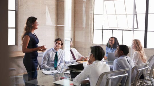 Businesswoman addressing colleagues