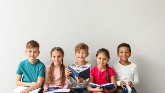 kids reading in a line