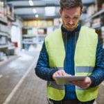 warehouse worker looking up order