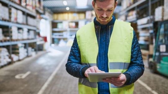 warehouse worker looking up order