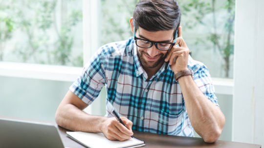 man on phone conference call