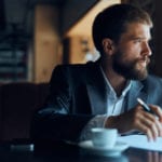 businessman thinking at a coffee shop