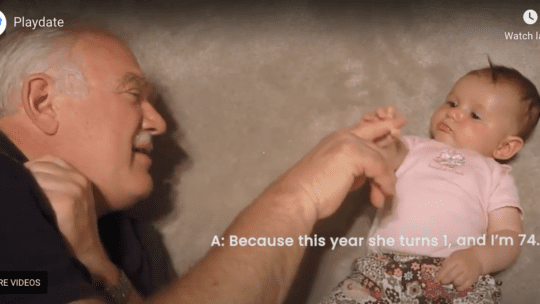 Grandpa plays with baby granddaughter