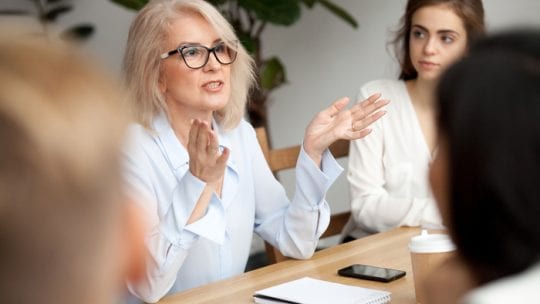 female leader in business meeting