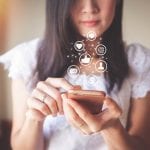 Woman using mobile phone for checking social media