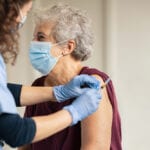 older woman getting vaccinated