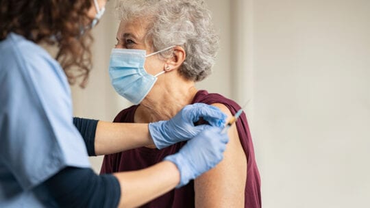 older woman getting vaccinated