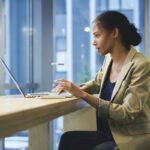 woman reading press releases on a computer