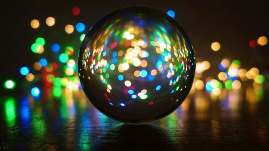 A crystal ball highlights the PRNEWS team's 2022 PR predictions