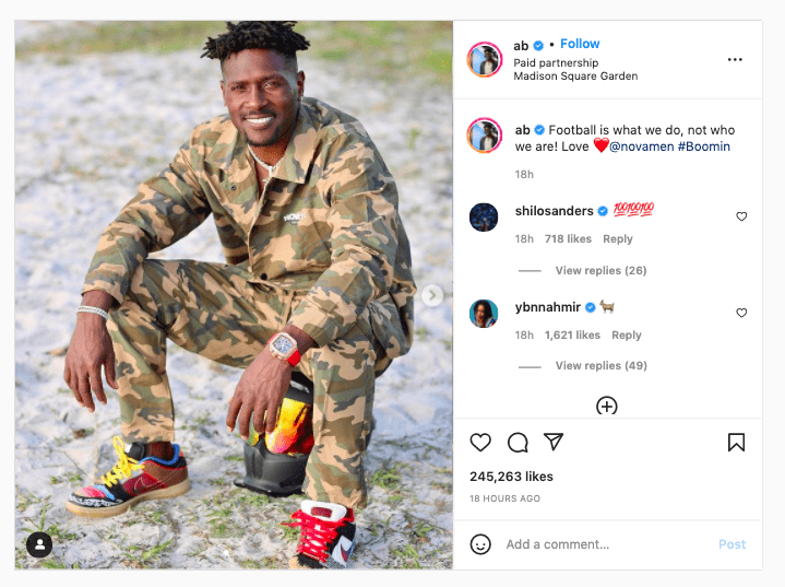 Instagram post of Antonio Brown sitting down in fashionable camoflauge suit