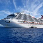 Carnival Cruise Line ship on the open sea, blue sky