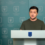 Ukrainian President Zelenskyy speaks at podium