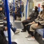 riders on public transportation wear masks