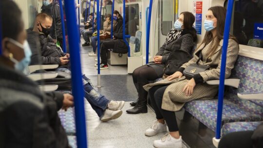 riders on public transportation wear masks