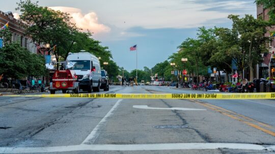 Police caution tape crosses street in Highland Park after Fourth of July shooting incident