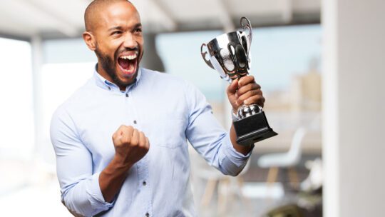 man excited about winning an award