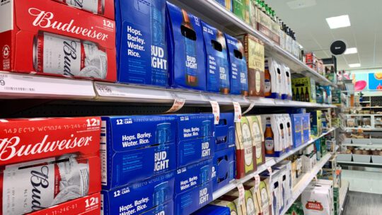 Bud Light in an aisle at the grocery store.