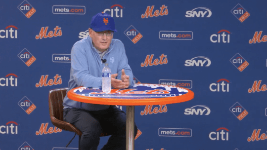 Mets' owner Steve Cohen sits down at a Mets round pub table for a press conference on June 28