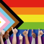 lgbtq, trans and intersex rights concept - multiracial human hands showing thumbs up over rainbow progress pride flag on background