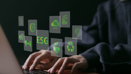 ESG environmental social governance investment business concept. woman uses a computer to analyze ESG data. ESG icons pop up on virtual screen in business sustainability investment strategy concept.