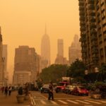 The Empire State Building disappears in an orange haze due to the Canadian Wildfire smoke clouds drifting over the Northeastern U.S.