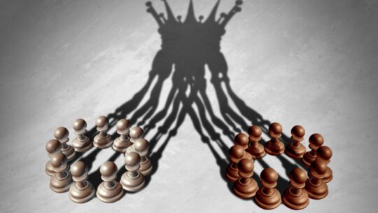 Business group leadership concept as a merger and acquisition and corporate teamwork combining strengths as chess pawns forming a king crown cast shadow as a 3D illustration.