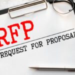 RFP- Request For Proposal written in notebook.