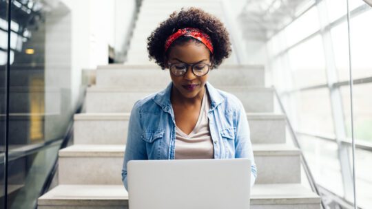 photo of a student working on a laptop in regards to what PRNEWS readers learned from their college days