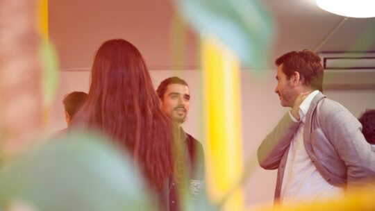 Corporate employees mingling at a reception