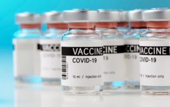 ampoules with Covid-19 vaccine on a laboratory bench. to fight the coronavirus / sars-cov-2 pandemic.