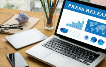 Press Release Laptop on table.