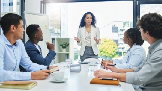 Shot of a businesswoman giving a presentation to her staff.