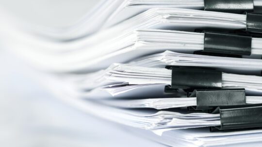 a pile of papers made to look like the Epstein documents