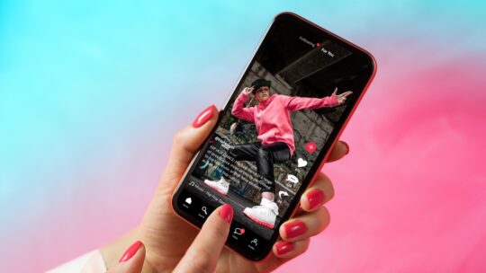 Sample TikTok app interface on mobile phone showing shared video content