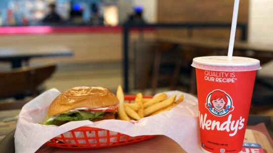 Wendy's burger set and drink on table. Wendy's is the world's third largest hamburger fast food chain with approximately 6,650 locations.