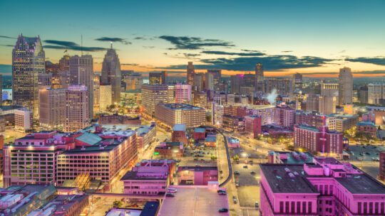 Detroit, Michigan, USA downtown skyline from above at dusk.