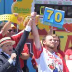 Joey Chestnut & George Shea mark JULY 4 2016 Nathan's Famous Fourth of July Hot Dog Eating Contest centennial
