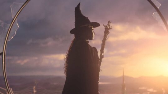 Wicked's green witch, Elphaba, looks out on the horizon in her witch hat