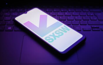 The South by Southwest (SXSW) logo appears on a smartphone screen in this illustration photo