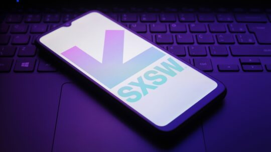 The South by Southwest (SXSW) logo appears on a smartphone screen in this illustration photo