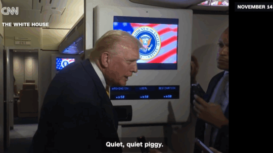 CNN screenshot of President Trump on Air Force One with the White House Press Pool saying "Quiet Piggy" to a Bloomberg reporter