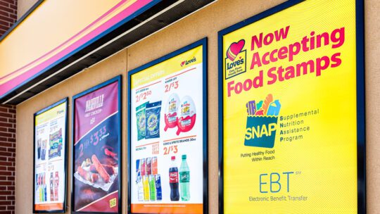 2019: Love's gas station and sign on building exterior entrance in Missouri with convenience store closeup for food stamps